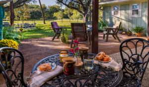 Image of Courtyard at HarBet Lodge with donuts on the outdoor patio table in Alvin Texas